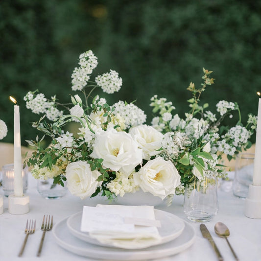 Porcelain Still Life Vessel Composition styled with layered white florals and candlelight on refined neutral wedding tablescape.