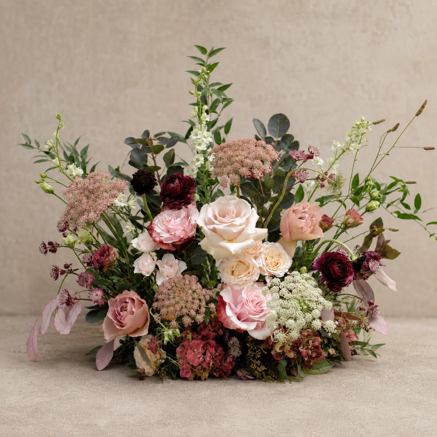 Moody burgundy, mauve and blush meadow arrangement