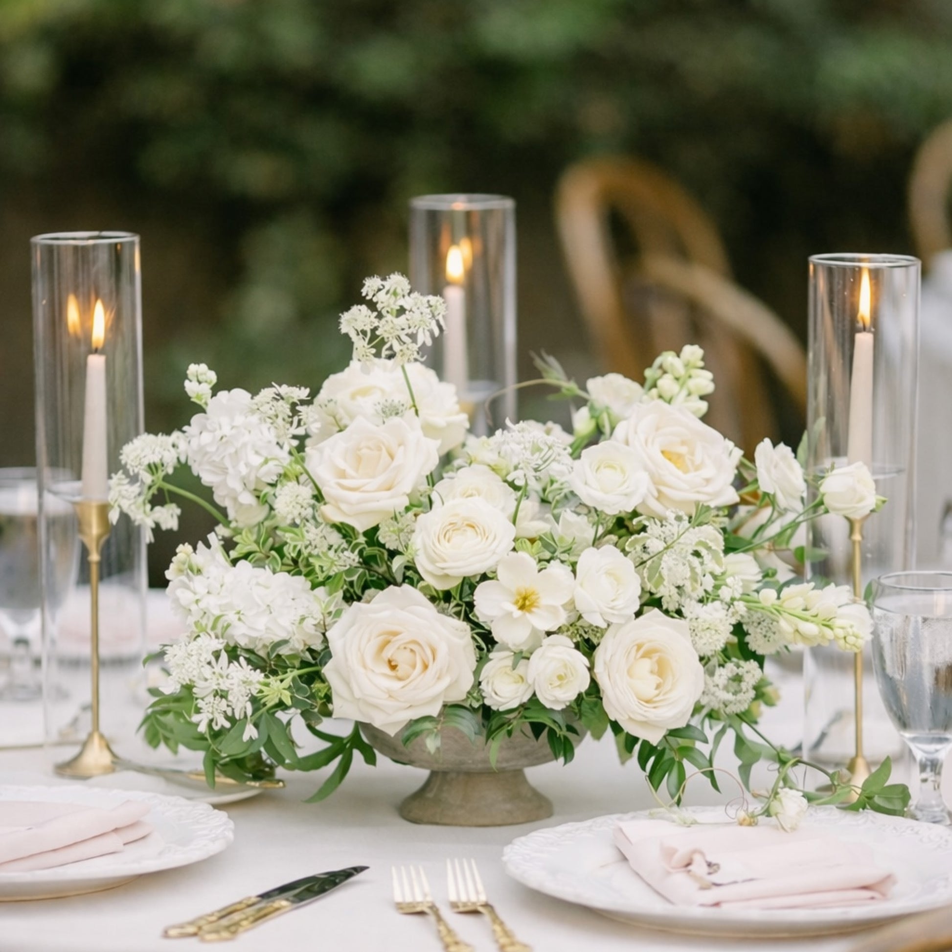 Porcelain Heirloom Compote Composition centerpiece with layered white garden roses and airy seasonal blooms arranged in classical footed compote bowl.