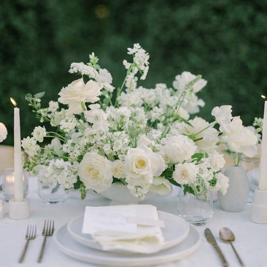 Porcelain large Still Life Vessel Composition with airy white garden blooms arranged in sculptural ceramic vessel centerpiece on elegant reception table.