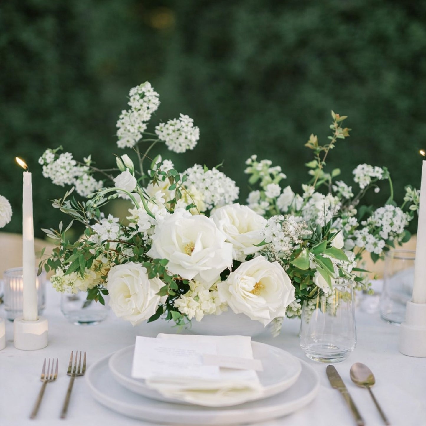 Porcelain Still Life Vessel Composition styled with layered white florals and candlelight on refined neutral wedding tablescape.