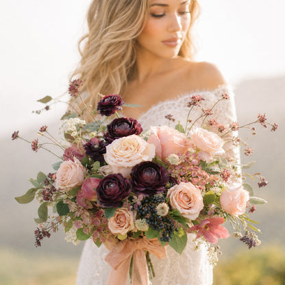 Moody bridal bouquet with burgundy, blush, mauve, and antique peach garden flowers.