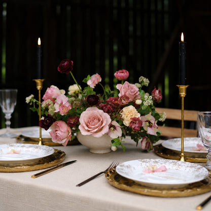 Moody still-life floral centerpiece styled on romantic wedding reception table