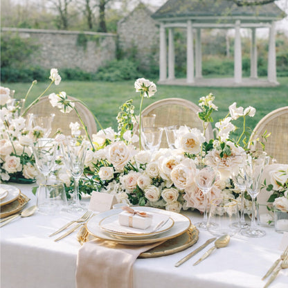 Rosewater growing garden runner extending across a romantic reception table with layered blush and ivory blooms.