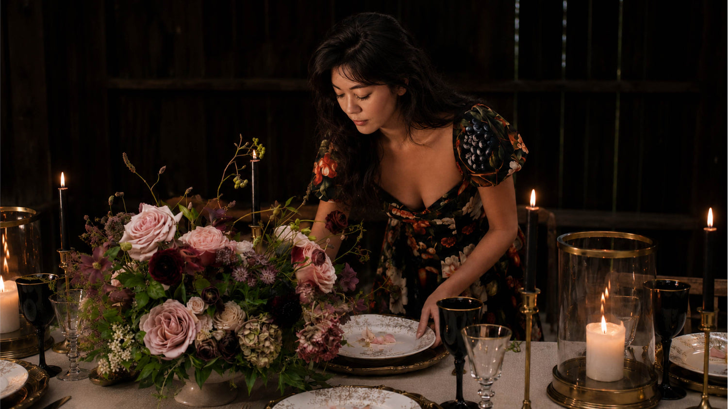 Alexandra of Redolence styling a candlelit wedding tablescape with garden-style florals and elegant tableware.